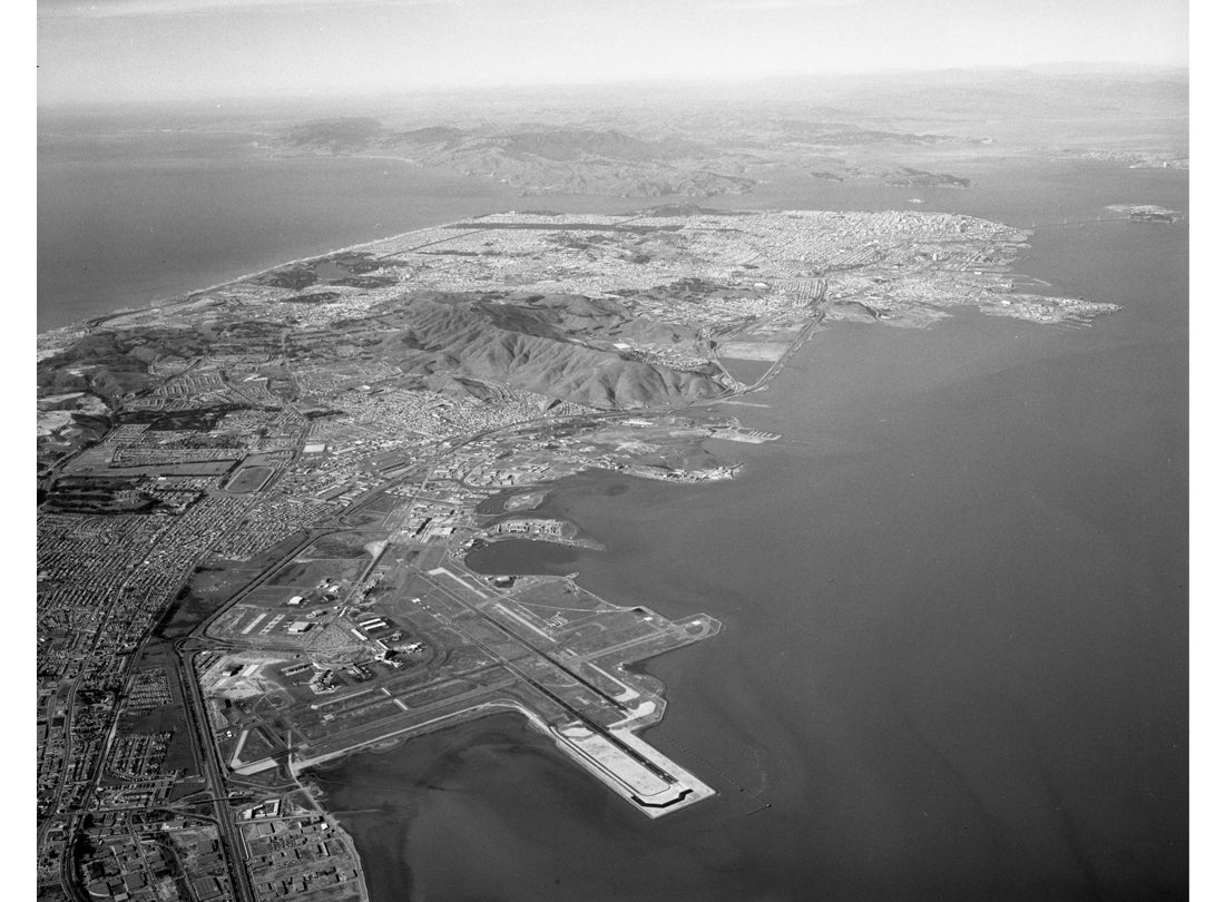 Aerial view of San Francisco International Airport (SFO) facing north toward the city of San Francisco  February 6, 1964