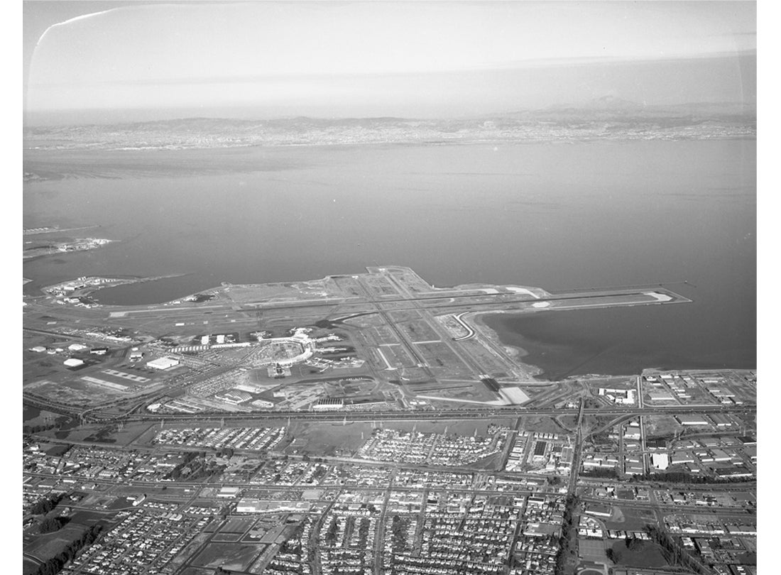 Aerial view of San Francisco International Airport (SFO) facing toward the East Bay  November 16, 1964