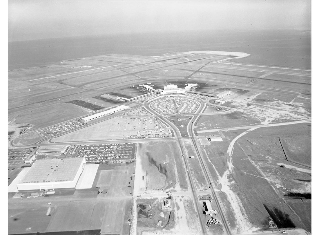 Aerial view of San Francisco International Airport (SFO) facing east toward International Terminal building (now Terminal 2) and runways  February 26, 1959