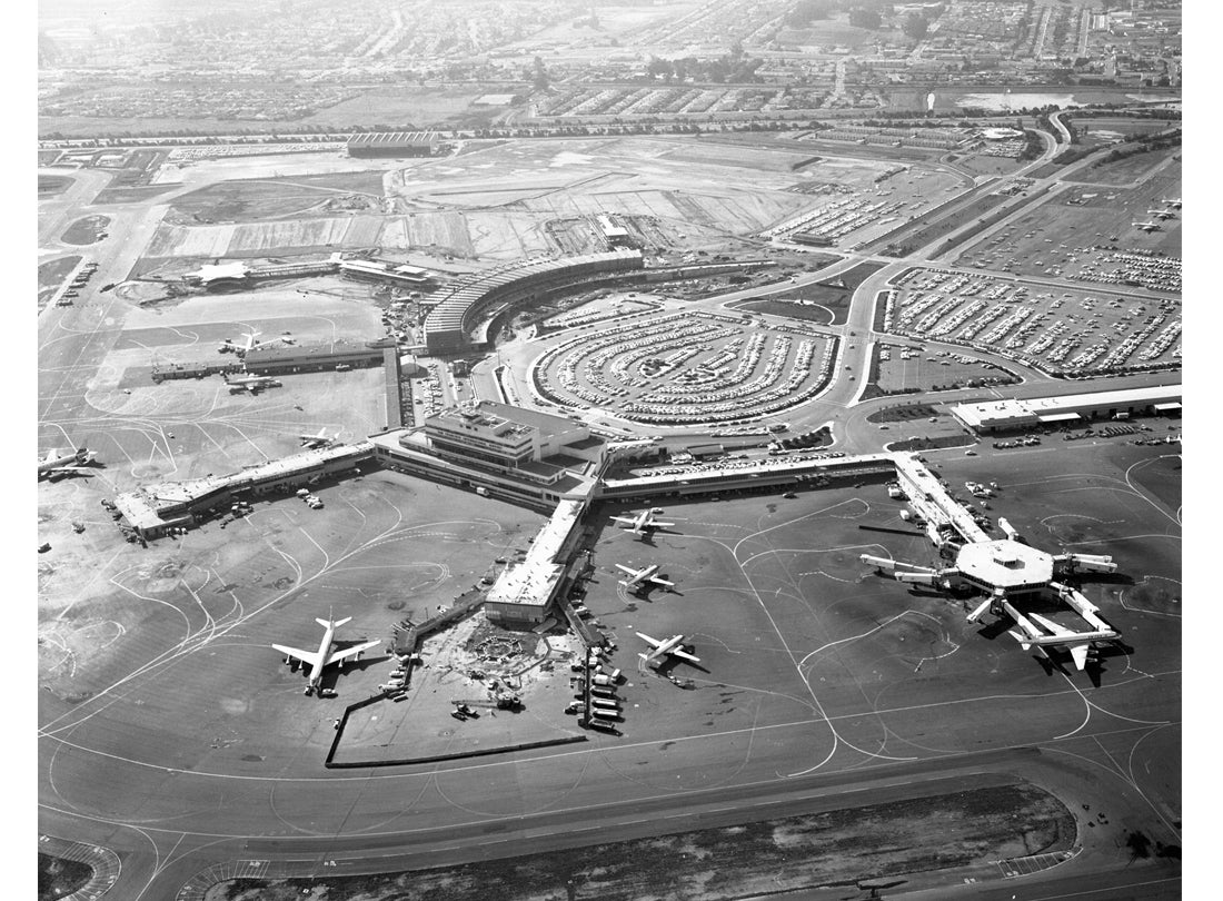 Aerial view of San Francisco International Airport (SFO) facing west toward International Terminal building (now Terminal 2) and ​​​​​​​South Terminal (replaced by Harvey Milk Terminal 1)  November 27, 1962