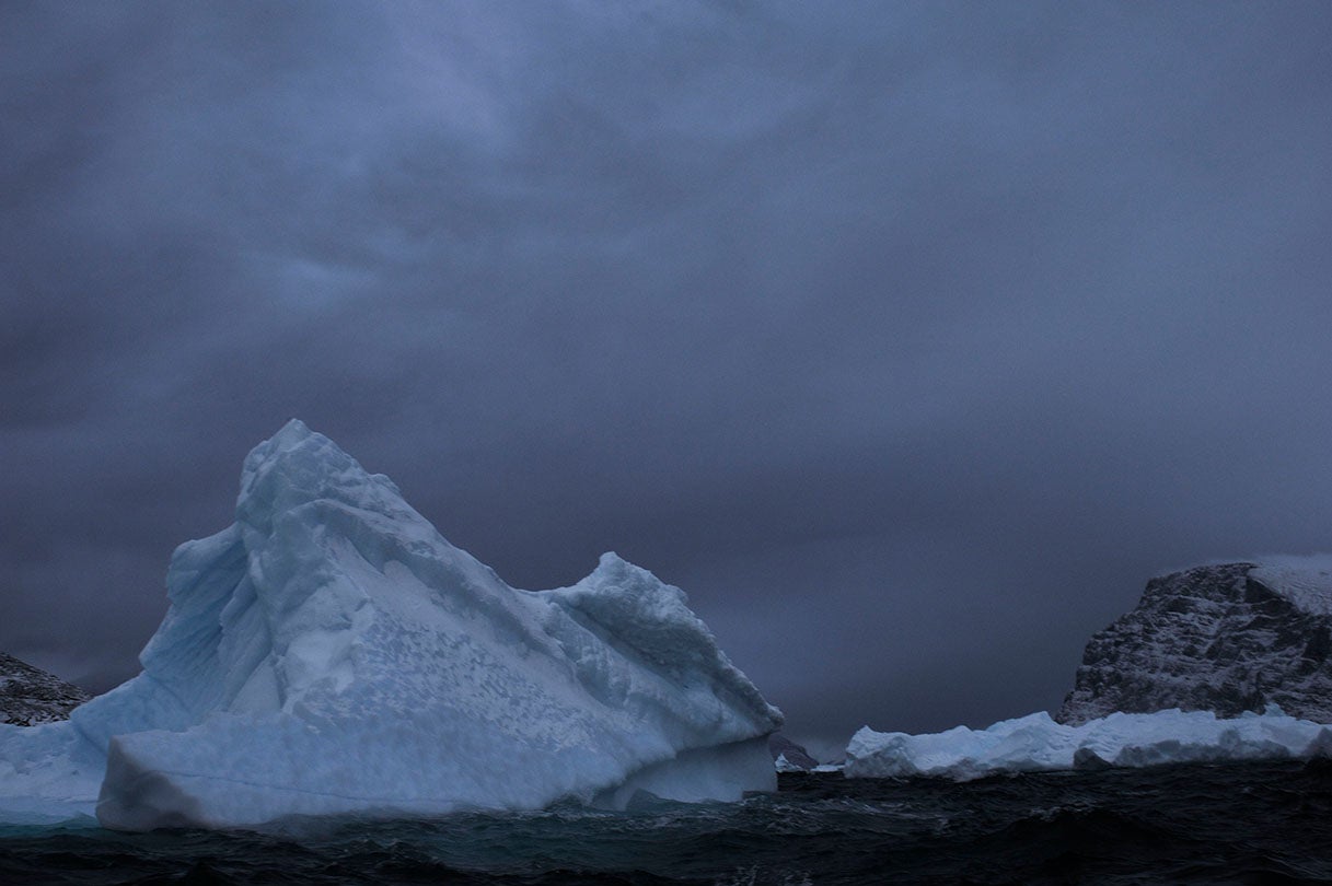 Iceberg cleaved from the Ilulissat Glacier floating outside of harbor of Uummannaq, Greenland  2009