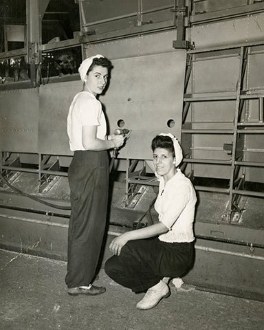 Susan Esposito (left) and her cousin Rose Hickey after setting a record for assembling a TBM Avenger wing trailing edge in four hours, ten minutes  1943