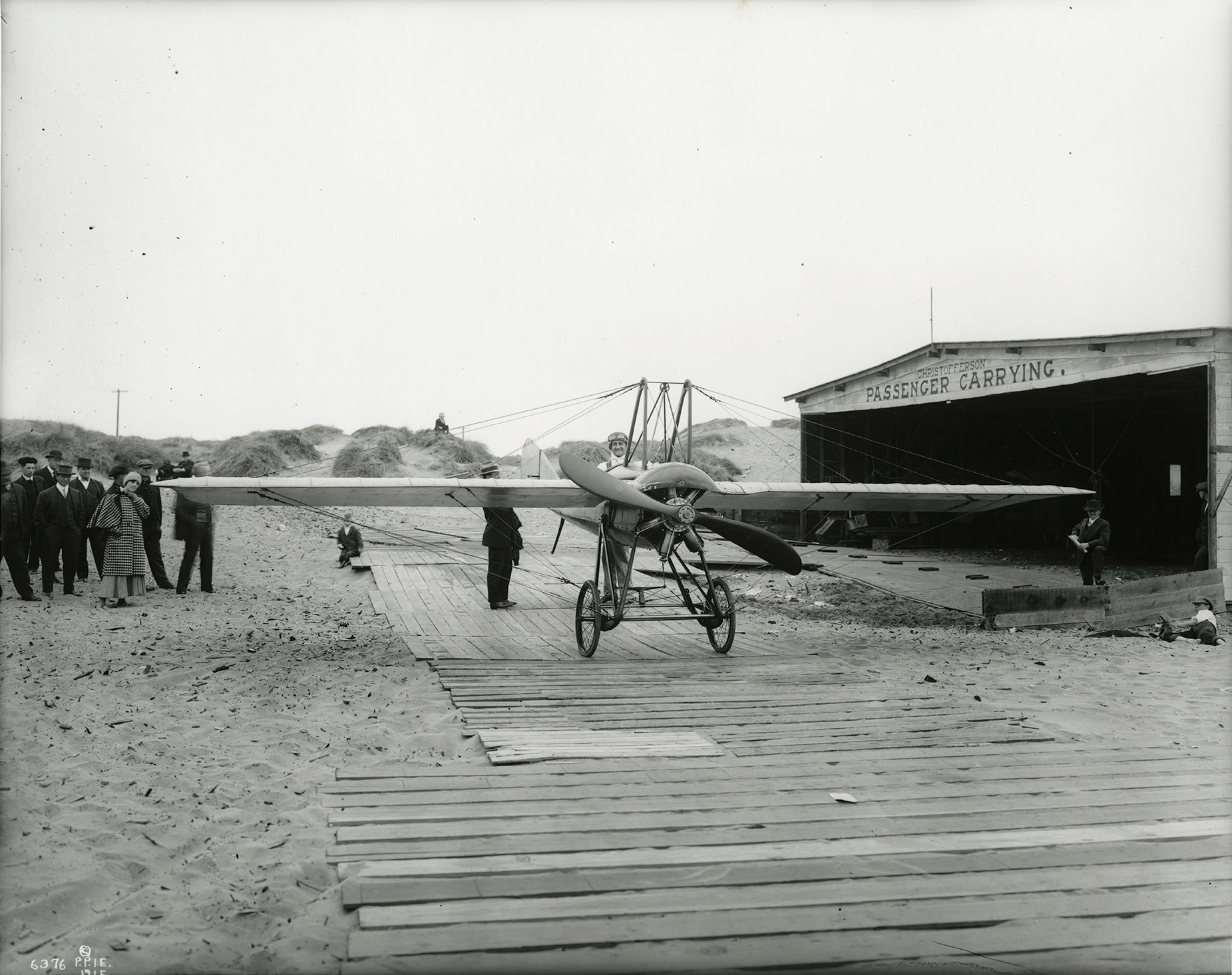 Silvio Pettirossi with his Deperdussin monoplane and wife Sarah (at left) at the Christofferson Hangar, Ocean Beach, San Francisco  1915