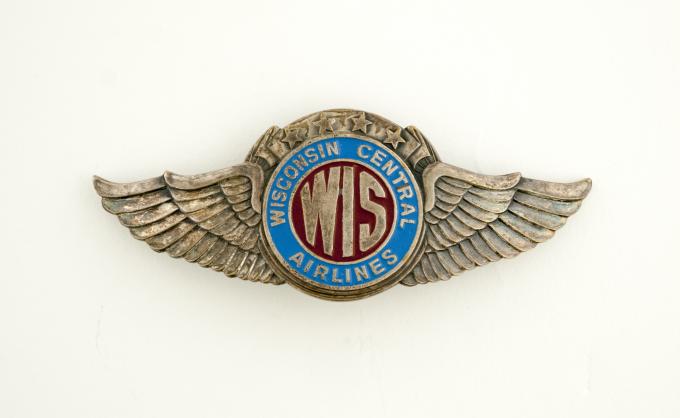 pilot cap badge: Wisconsin Central Airlines | SFO Museum