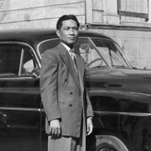 A Manong (First-Generation Filipino American) Stands Beside his 1949 Chevrolet De Luxe  