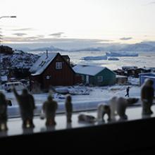 Carvings in a window facing the town of Uummannaq  2009