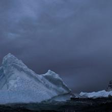 Iceberg cleaved from the Ilulissat Glacier floating outside of harbor of Uummannaq, Greenland  2009